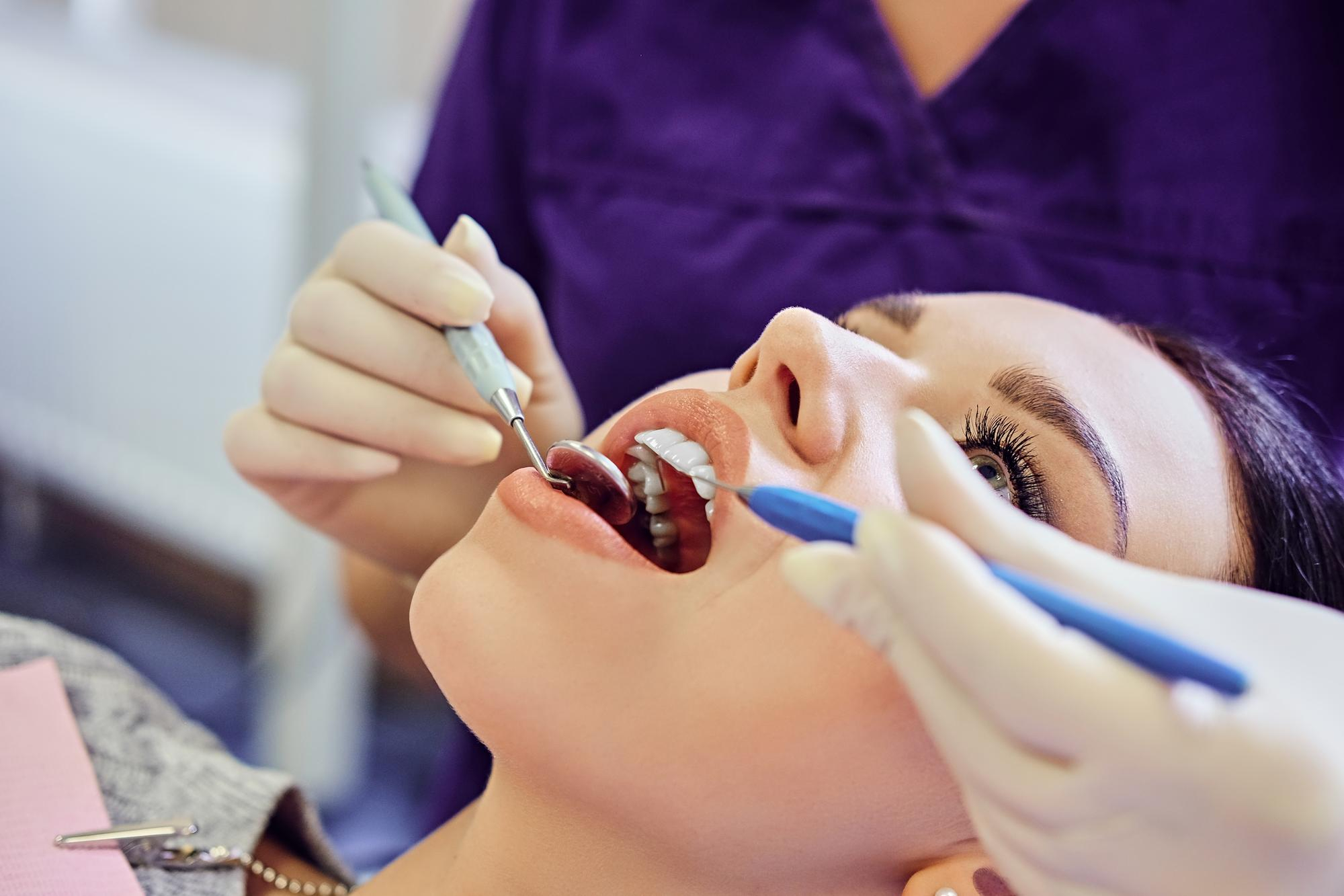 Patient showing a bright, flawless smile after a cosmetic dentistry procedure