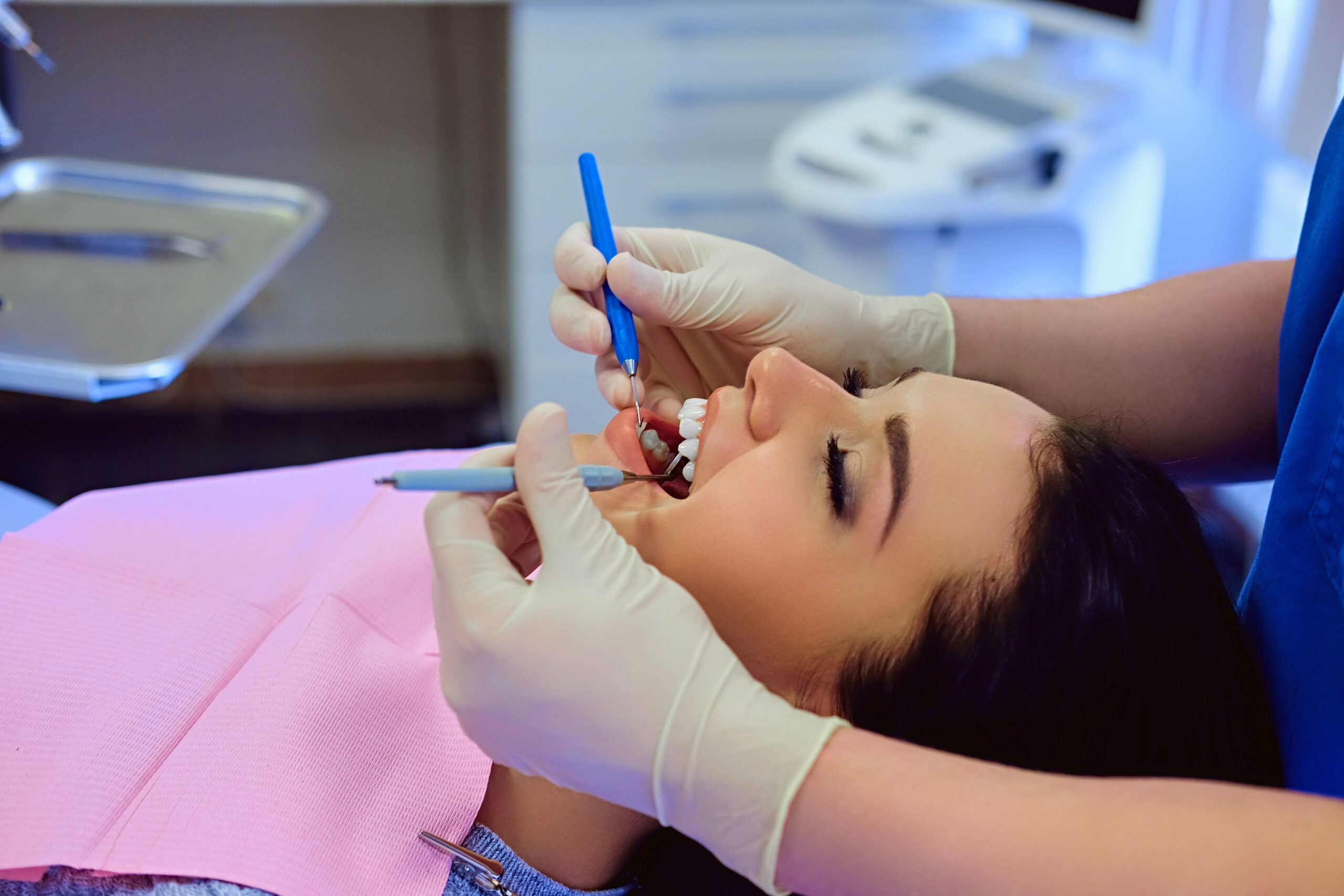Dentist performing precision root canal therapy with specialized tools